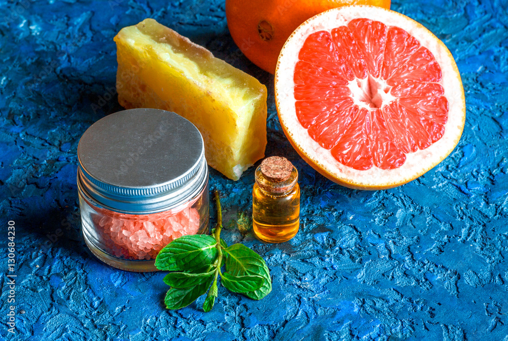 organic cosmetic with citrus on blue background