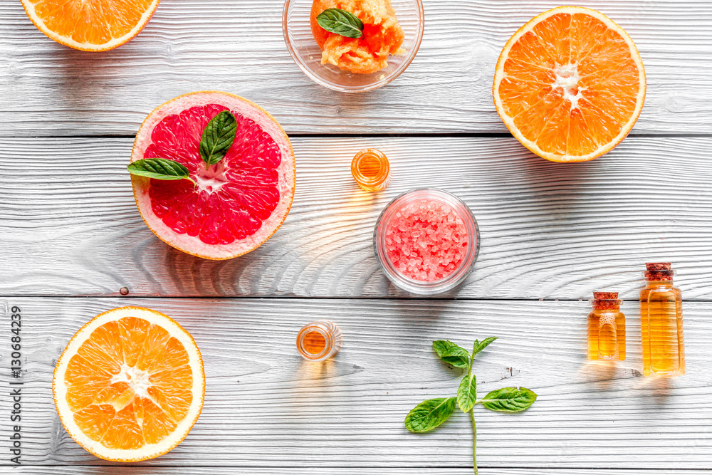 organic cosmetic with citrus on wooden background top view