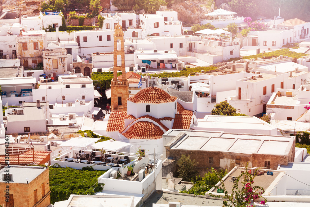 Top view of Lindos with stone bell tower, Greece