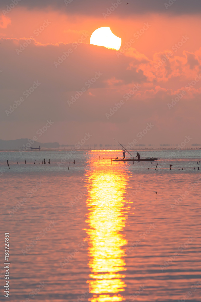 Solar eclipse (partial) at the Lampam  lake shore ,Phatthalung province, Thailand.