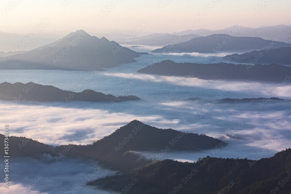 Beautiful Sunrise of travel place view the peak of mountain at Phu chi dao in Chiangrai,Thailand
