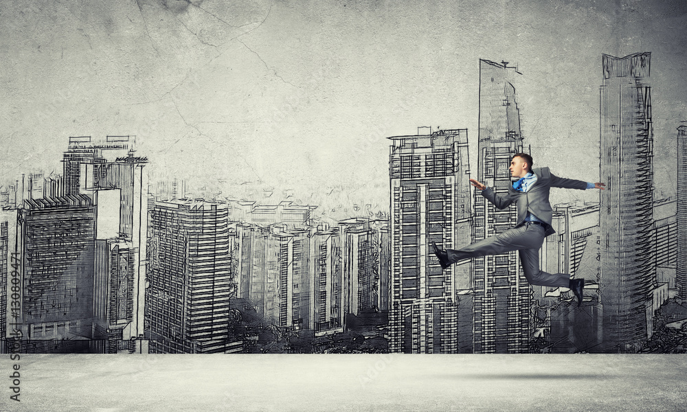 Businessman jumping high