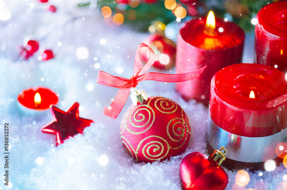 Red Christmas and New Year decorations over white snow background