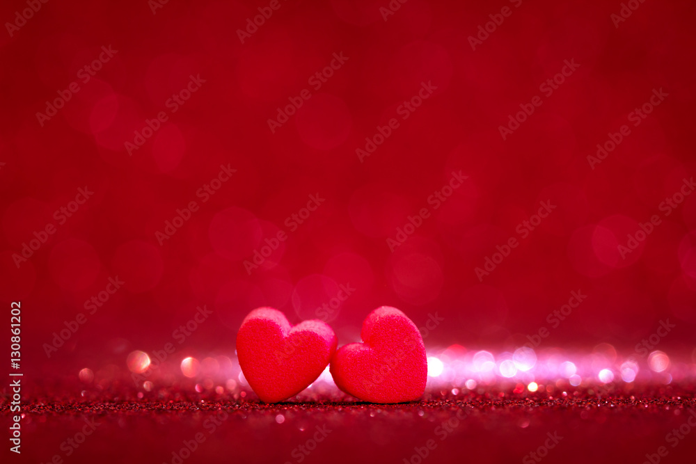 red Heart shapes on abstract light glitter background