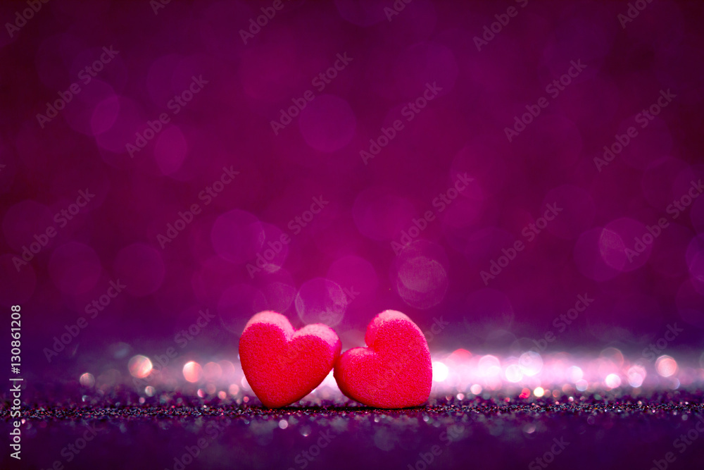 red Heart shapes on abstract light glitter background