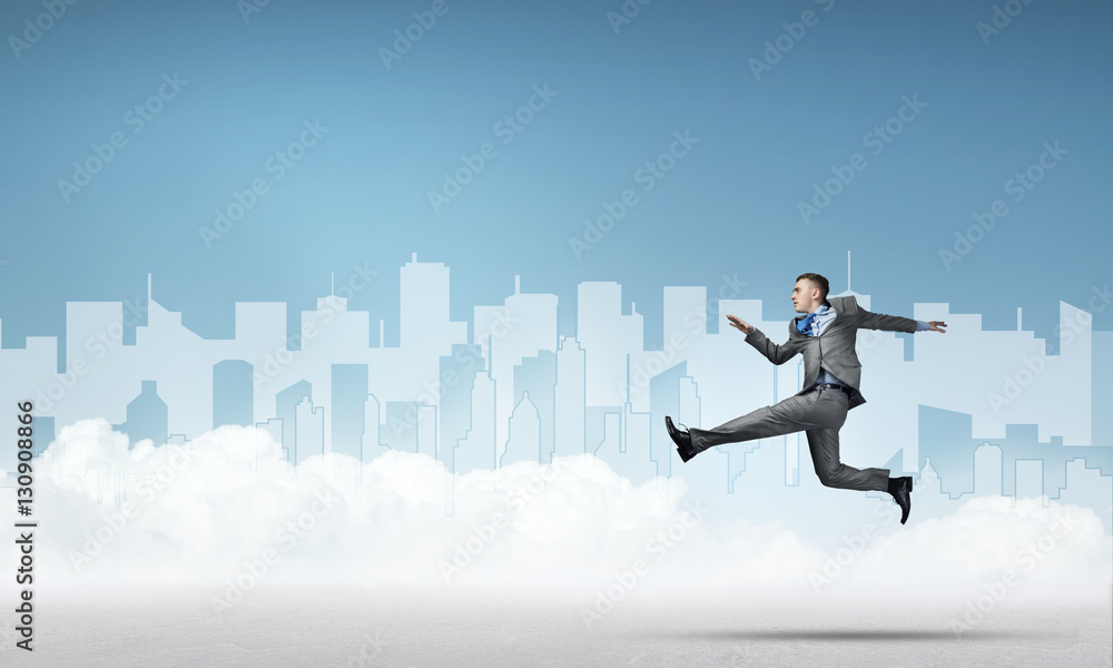 Businessman jumping high