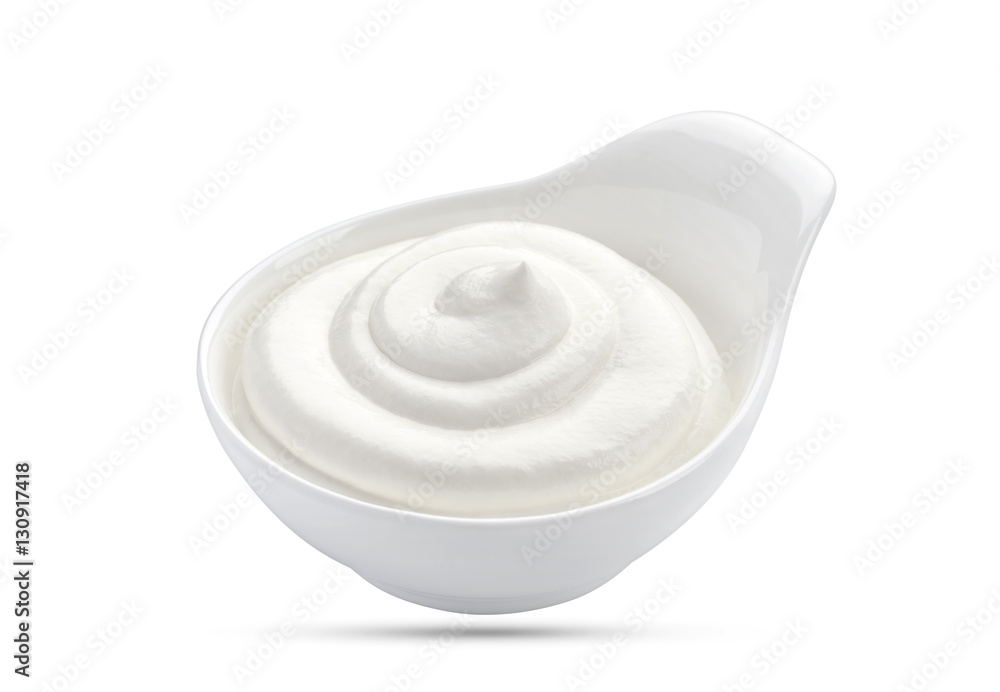 Sour cream in bowl isolated on white background