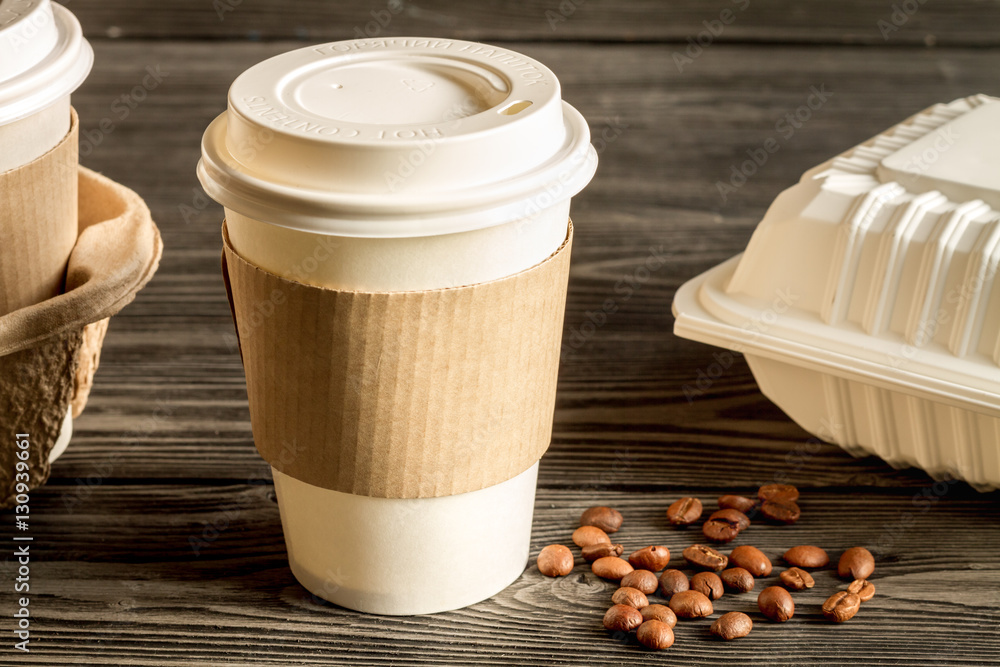 coffee cup to go at wooden background