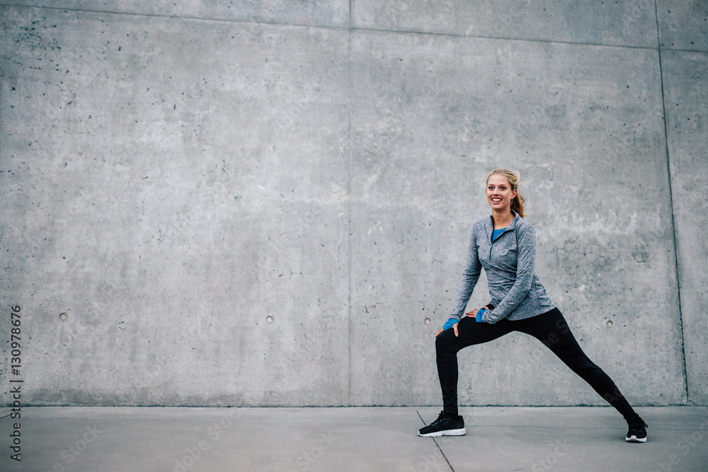 Female runner stretching after running session