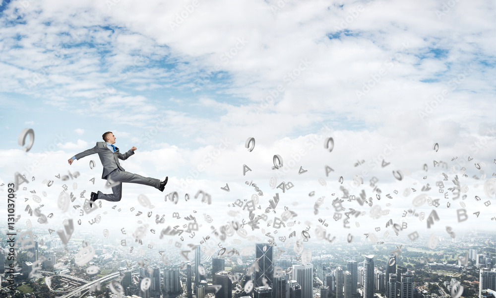 Businessman jumping high