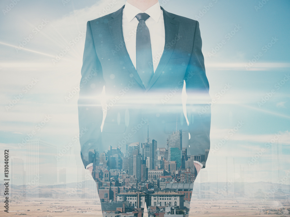 Businessman on city background multiexposure