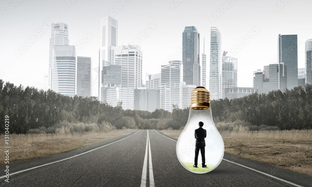 Businessman inside light bulb