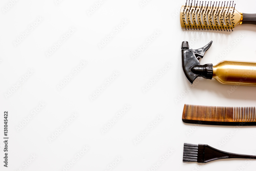 combs and hairdresser tools on white background top view