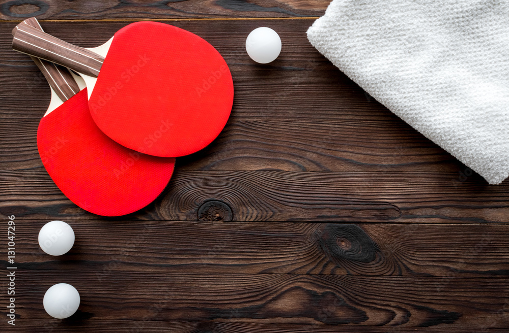 tennis racquet - fitness in the wooden background top view