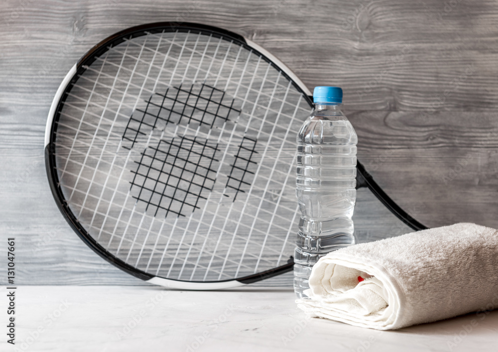 tennis racket on gray background close up