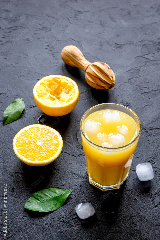 freshly squeezed orange juice on dark background