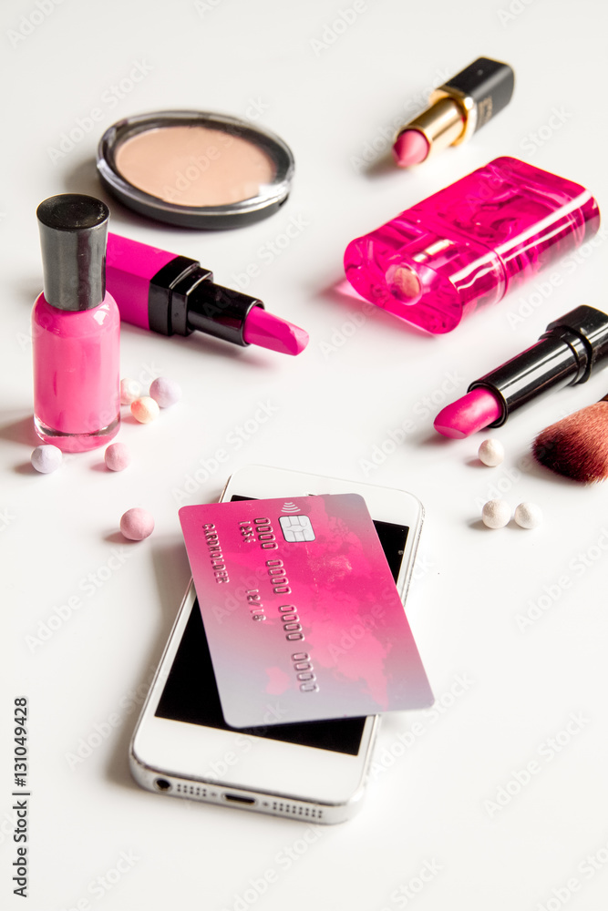 concept online shopping cosmetics on white background