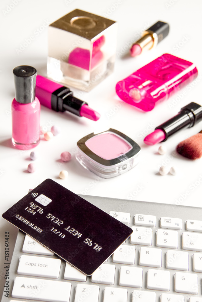 concept online shopping cosmetics on white background