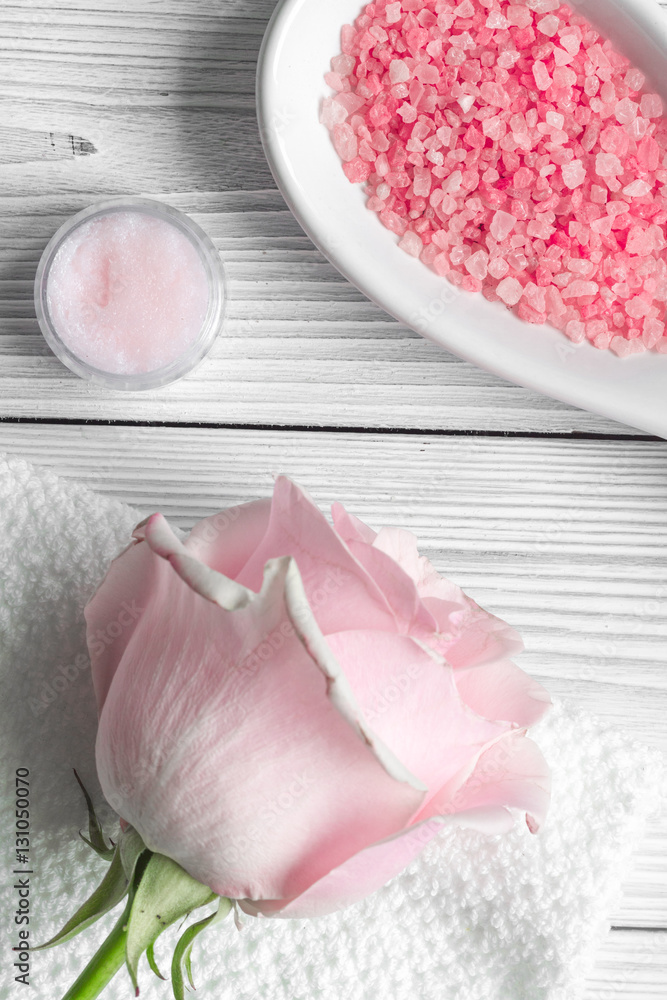 organic cosmetic with rose oil on wooden background top view