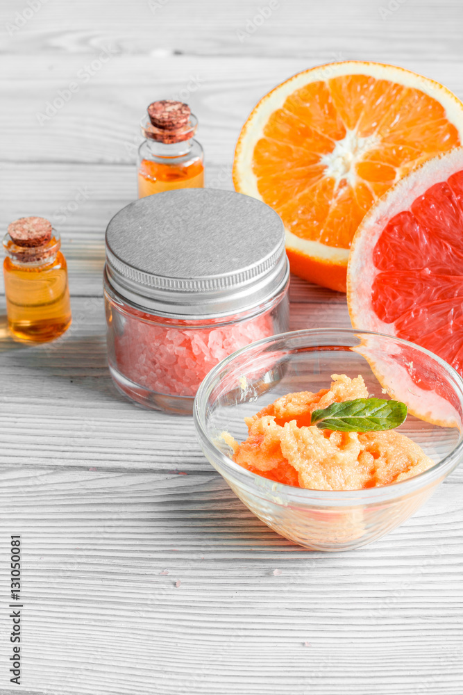 organic cosmetic with citrus on wooden background