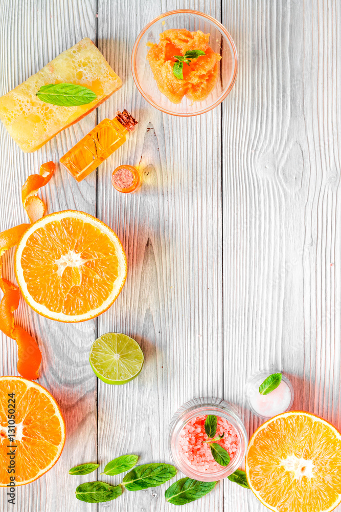 organic cosmetic with citrus on wooden background top view