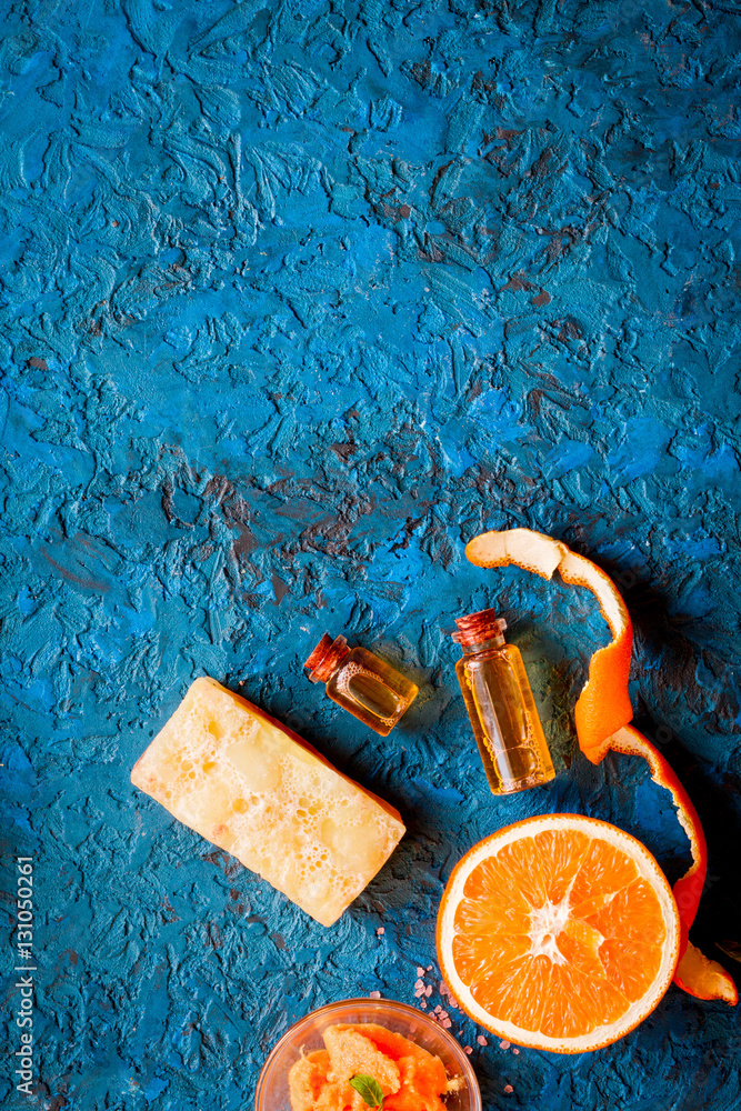 organic cosmetic with citrus on blue background top view