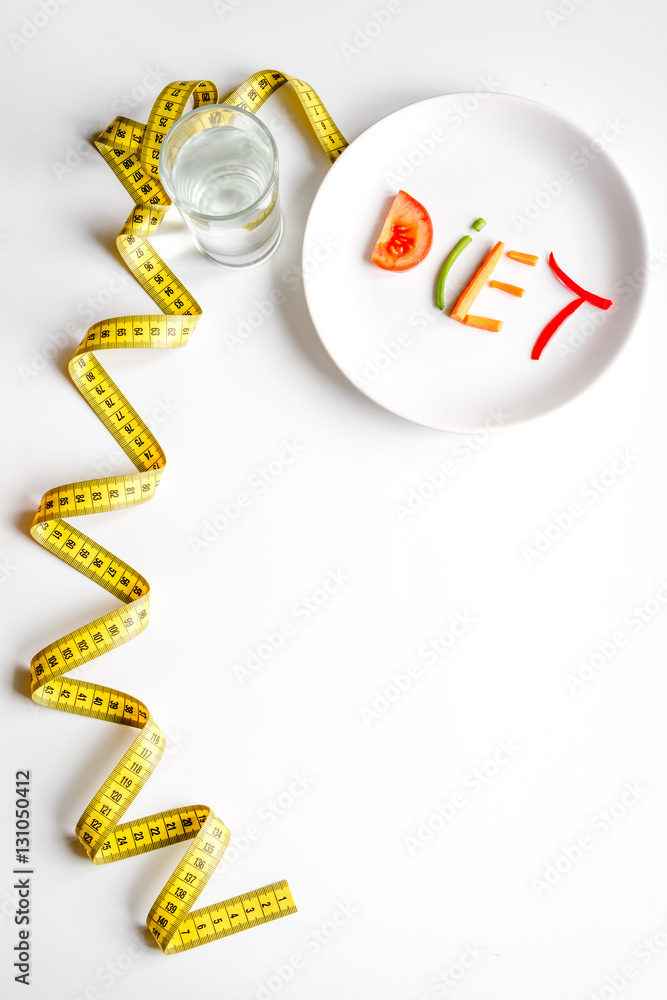 concept slimming diet fresh vegetables on white background top view