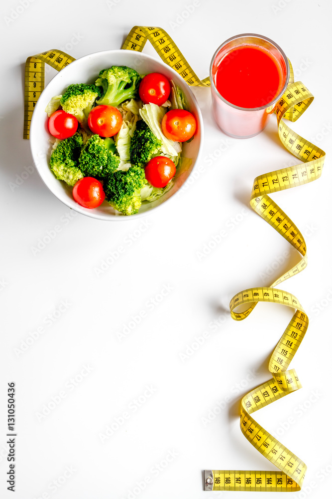 concept slimming diet fresh vegetables on white background top view