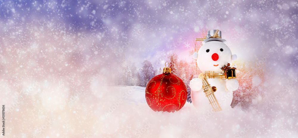 Winter background with christmas ball and snowman