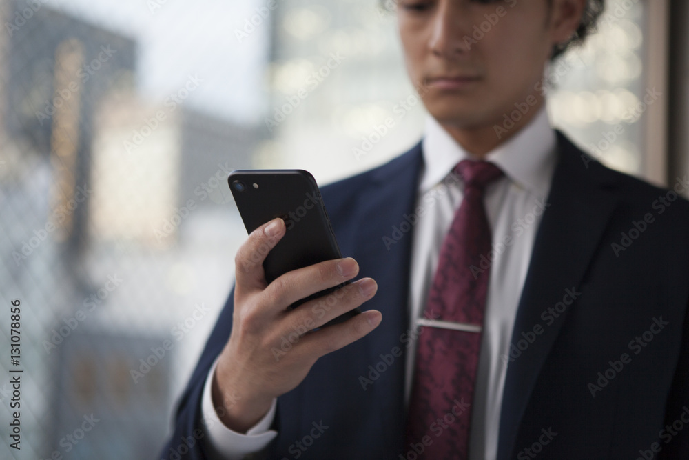 Young businessmen use smartphones