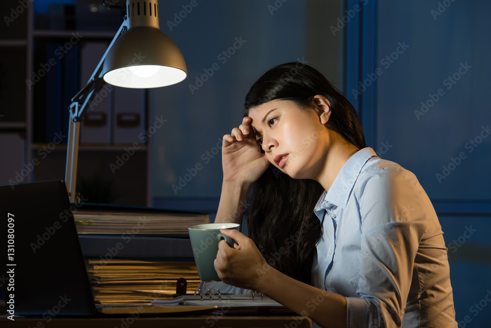 asian business woman drink coffee refreshing working overtime la