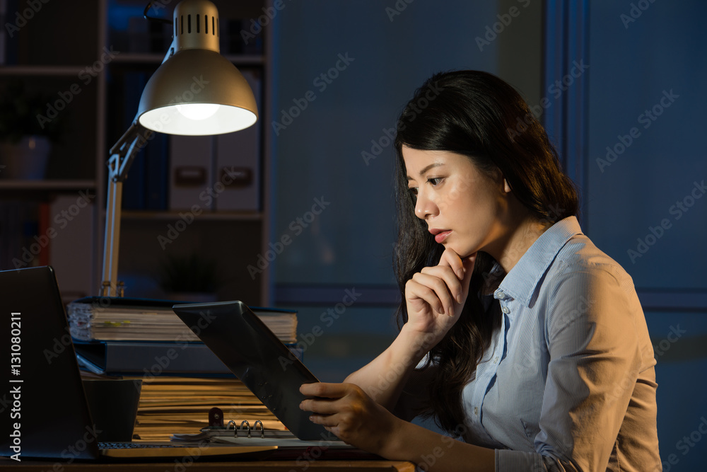 asian business woman use digital tablet working late overtime