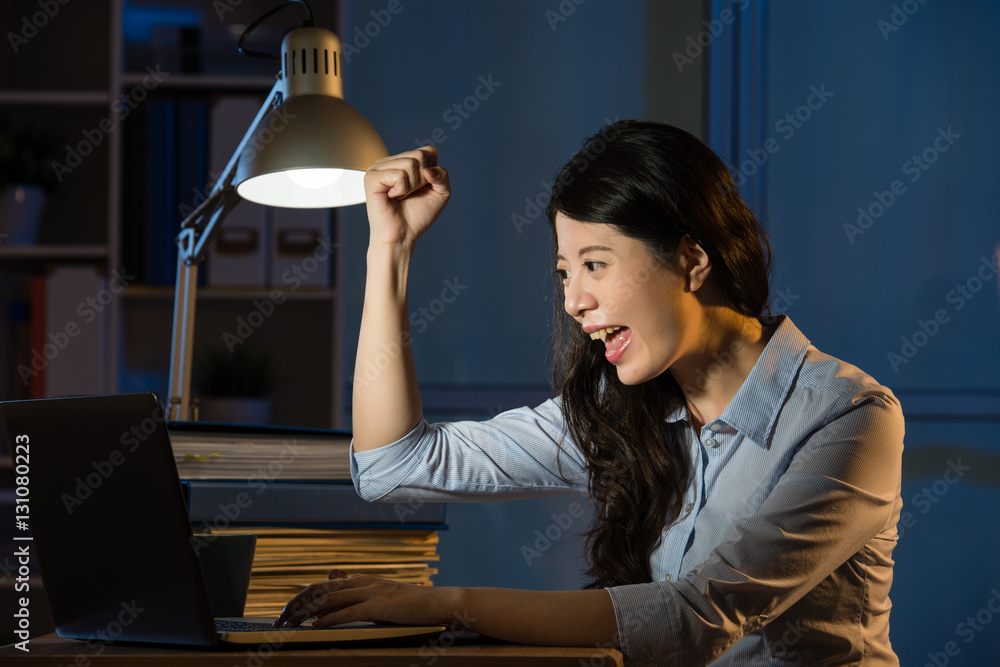 asian business woman happy got success idea working overtime