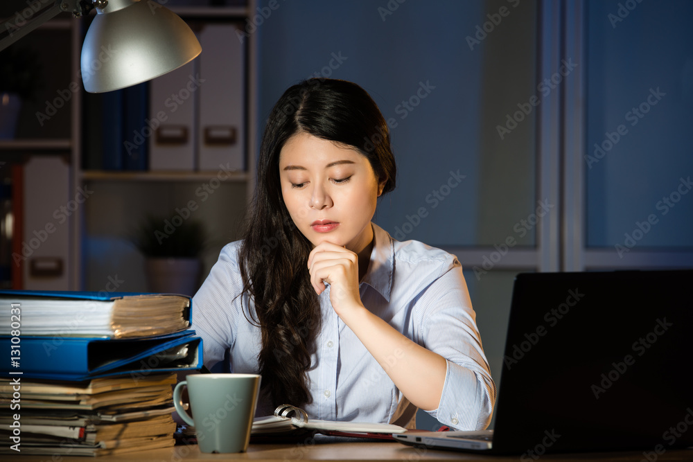 asian business woman working overtime late night in office