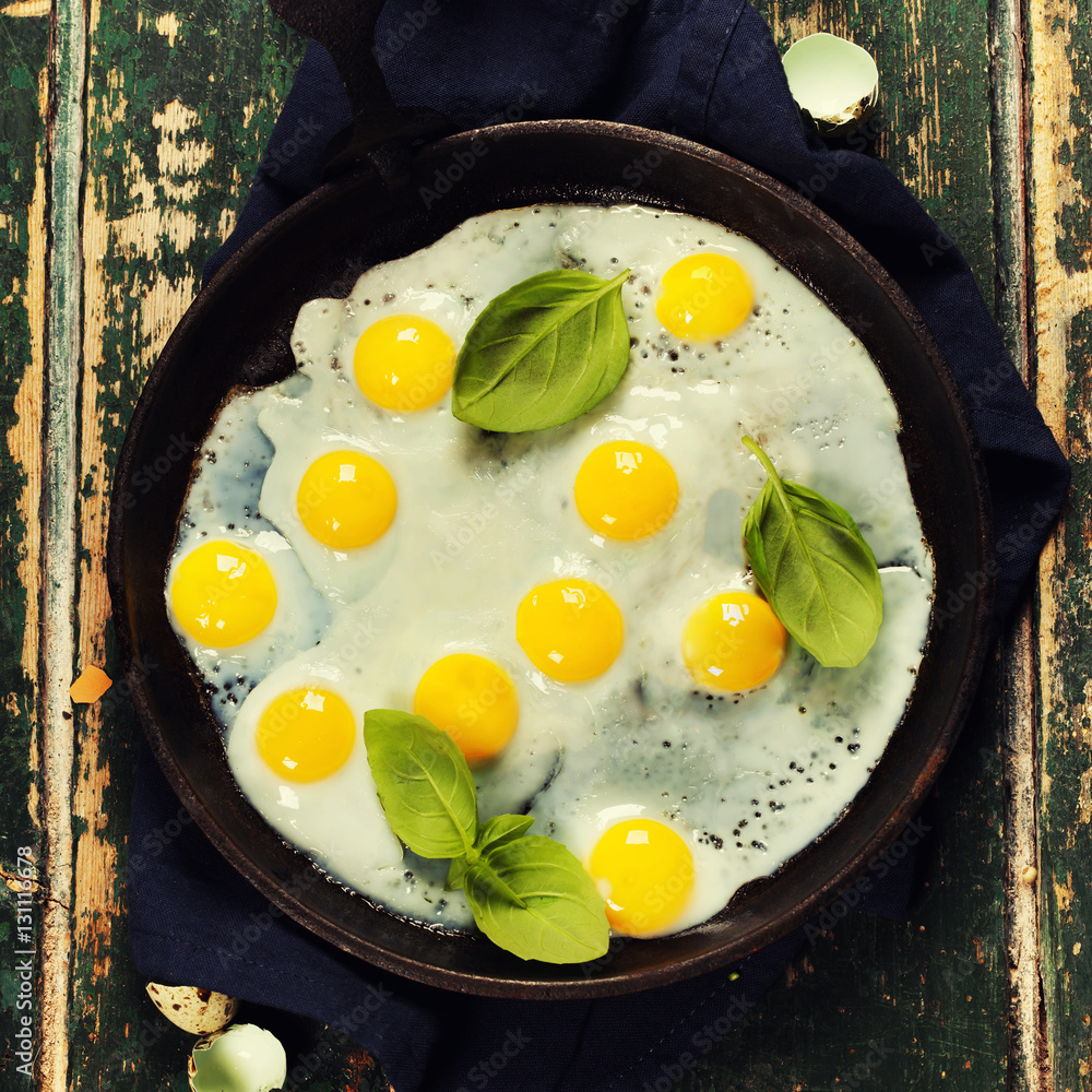 Pans with fried eggs