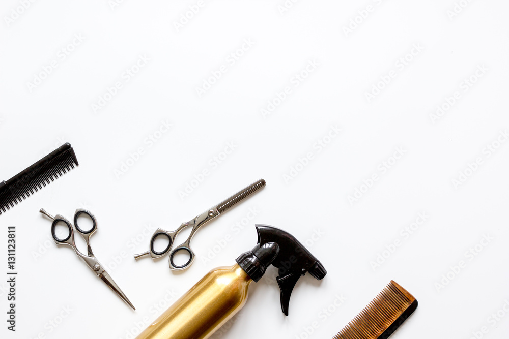 combs and hairdresser tools on white background top view