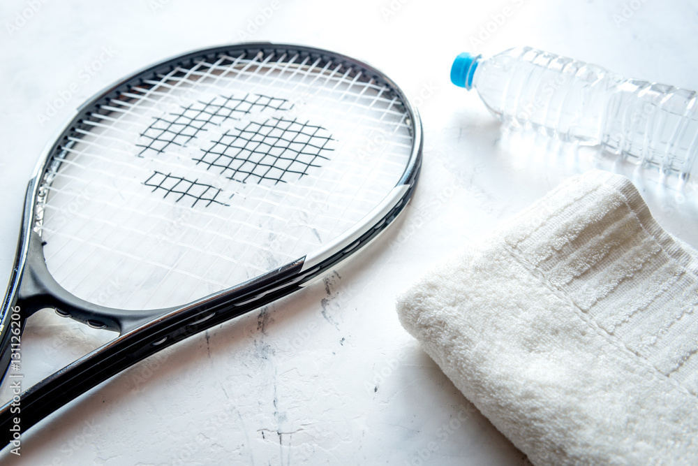 tennis racket on gray background close up