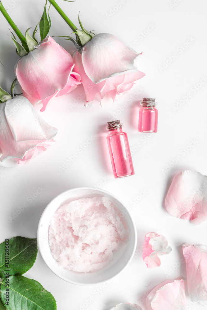 organic cosmetic with rose oil on white background top view