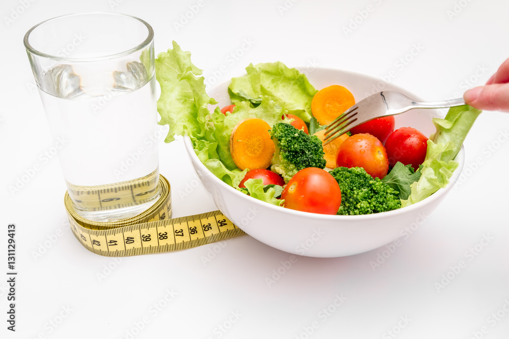 concept diet fresh vegetables on plate at white background