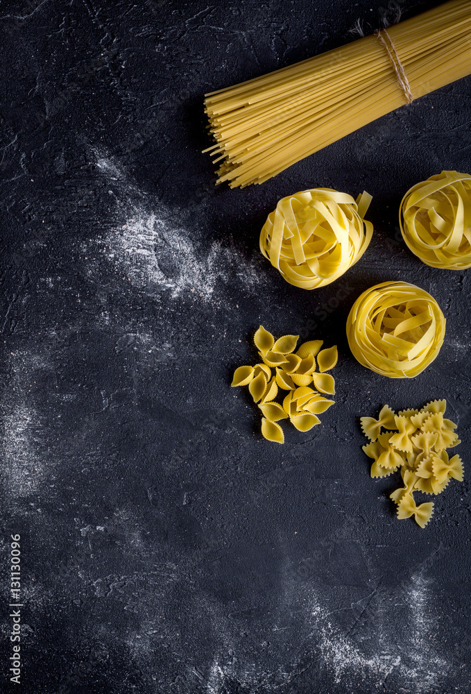 various kinds of paste on dark background top view