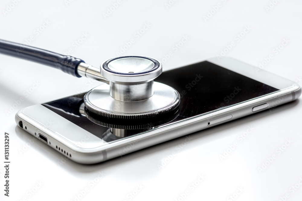 diagnostic of gadgets on white background with stethoscope