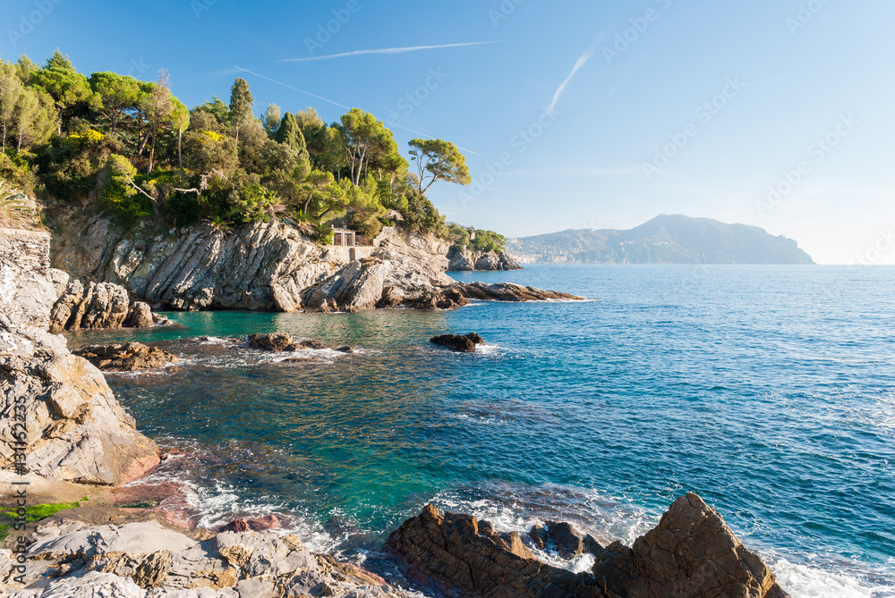 Rocky coastline near Genoa during a sunny winter morning