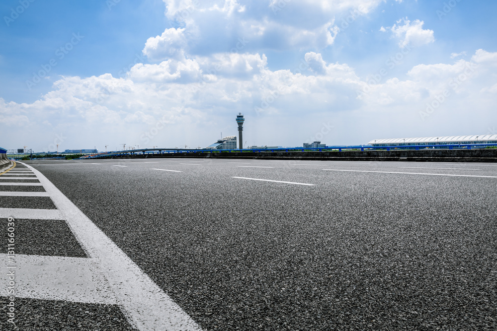 Asphalt road under the blue sky