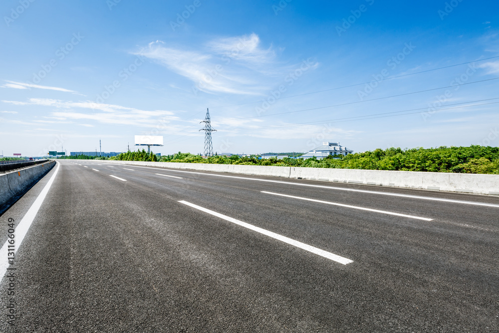 Asphalt road under the blue sky