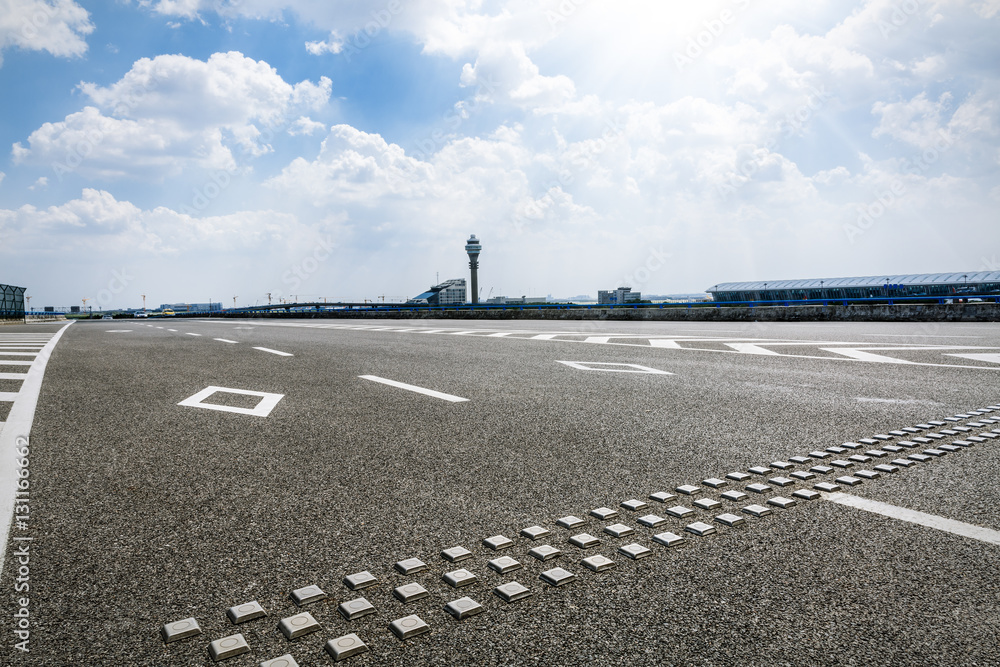 Asphalt road under the blue sky