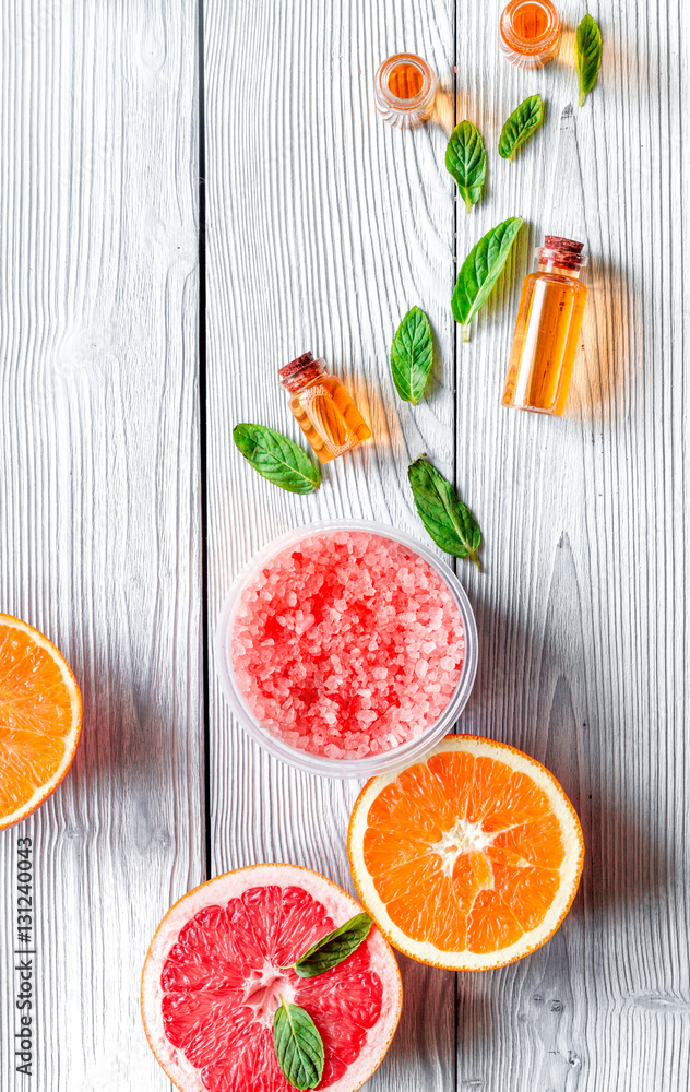 organic cosmetic with citrus on wooden background top view