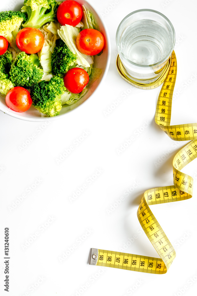 concept slimming diet fresh vegetables on white background top view