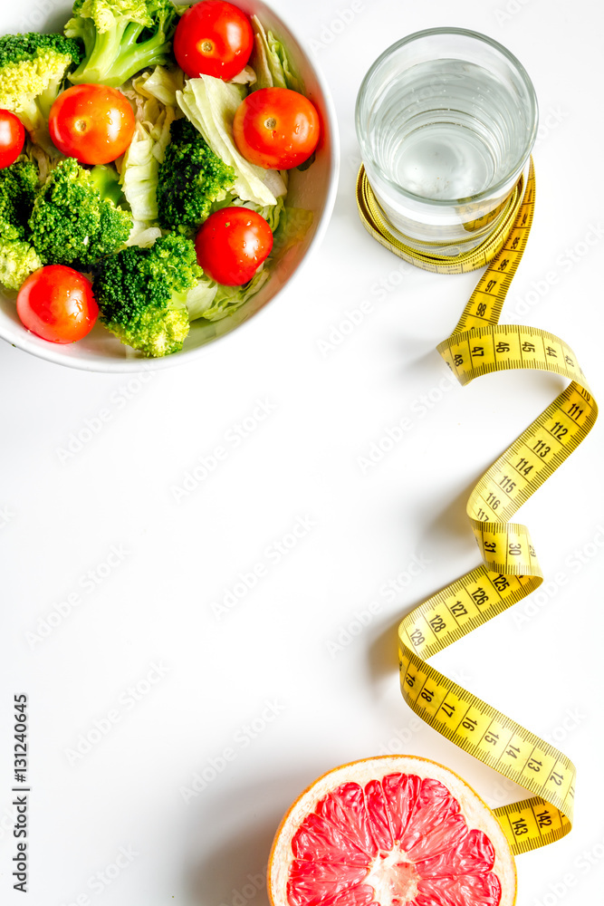 concept slimming diet fresh vegetables on white background top view