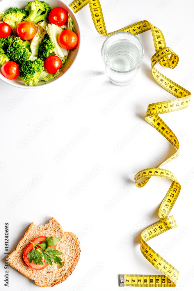 concept slimming diet fresh vegetables on white background top view