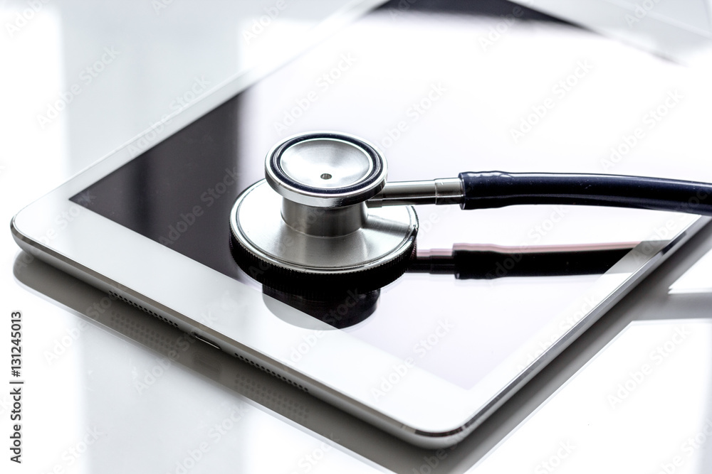 diagnostic of gadgets on white background with stethoscope